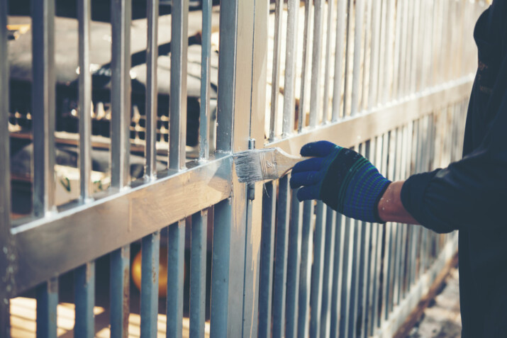 Painting metal fence